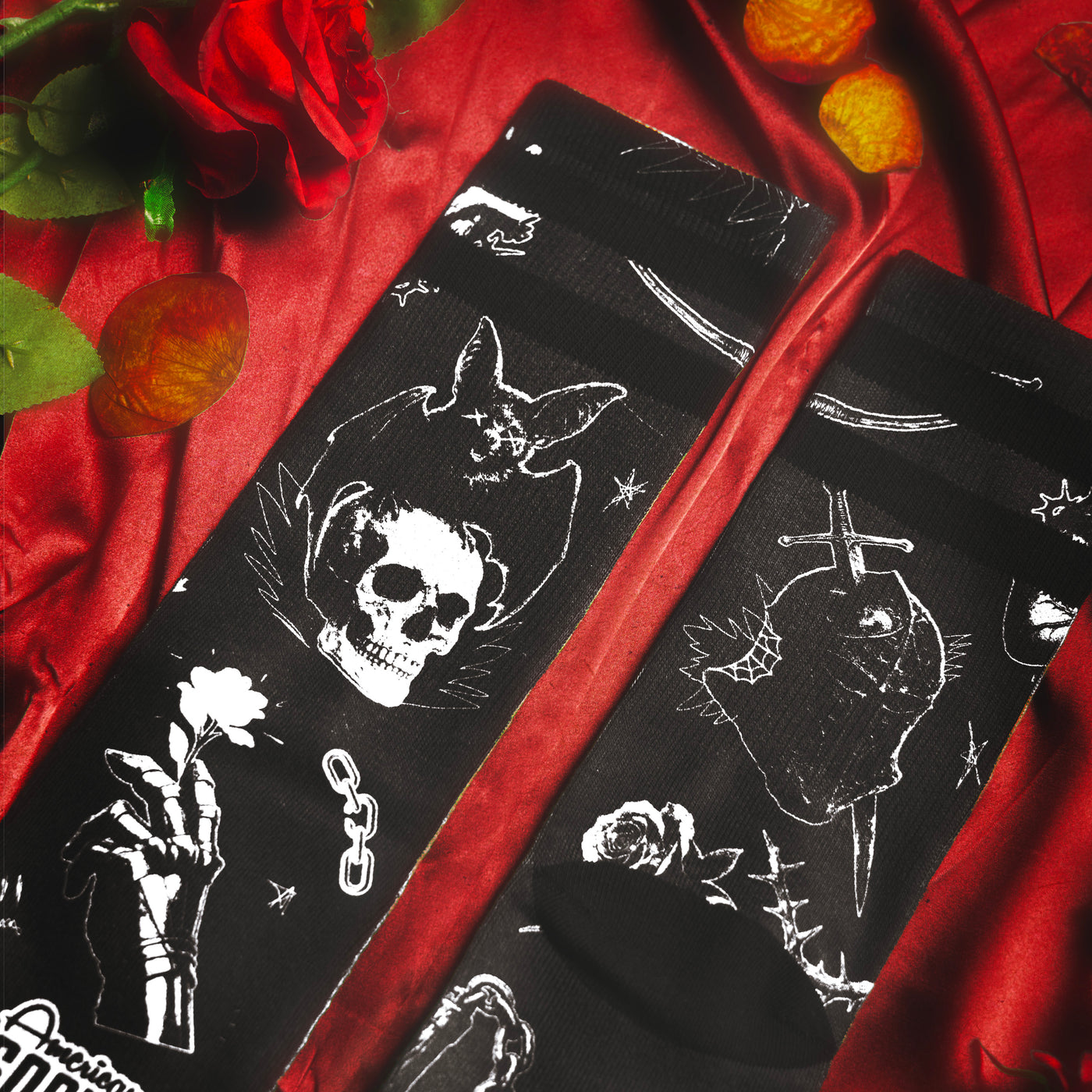 Close up black dark fantasy goth socks with bats knights and skulls medieval design by american socks