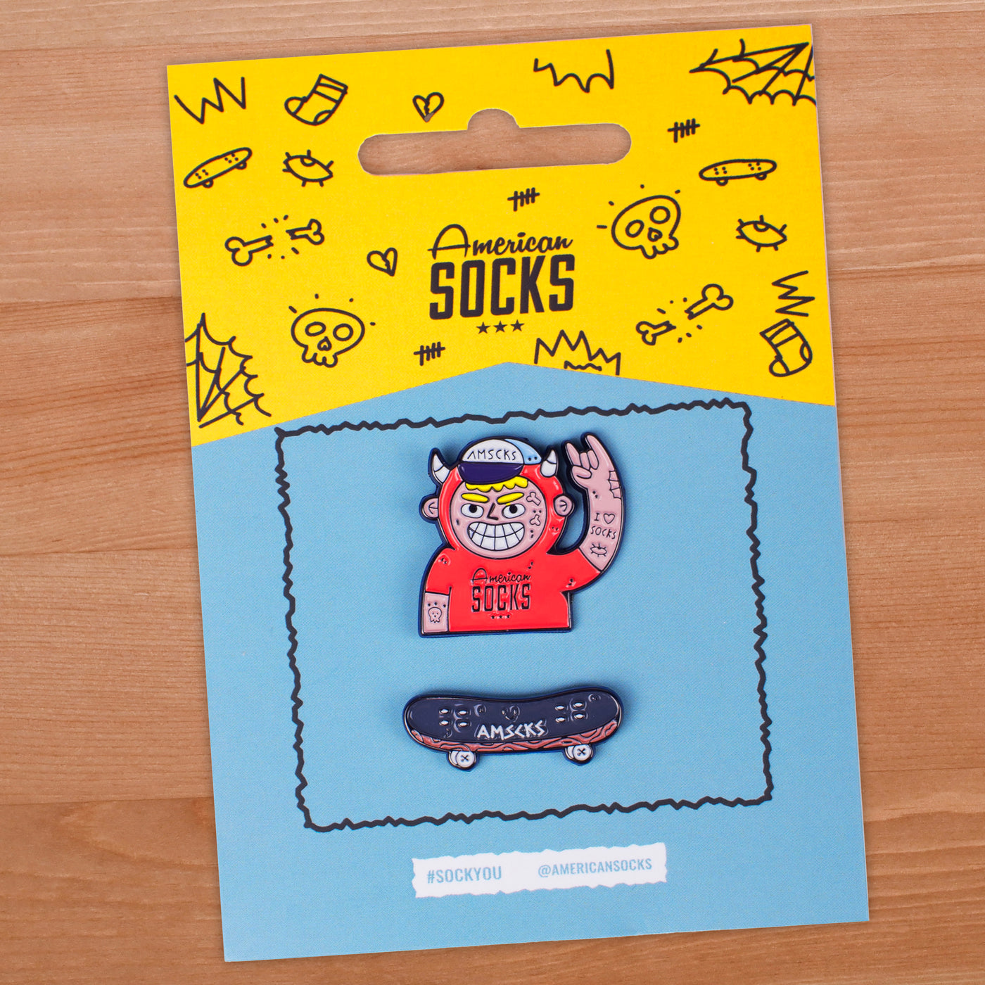 Unique pin pack containing fun punk character making rock hand sign pin and a skateboard pin american socks