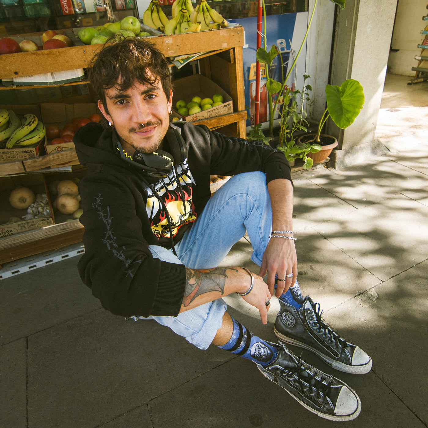 Man wearing alternative hoodie and pants with skater socks american socks