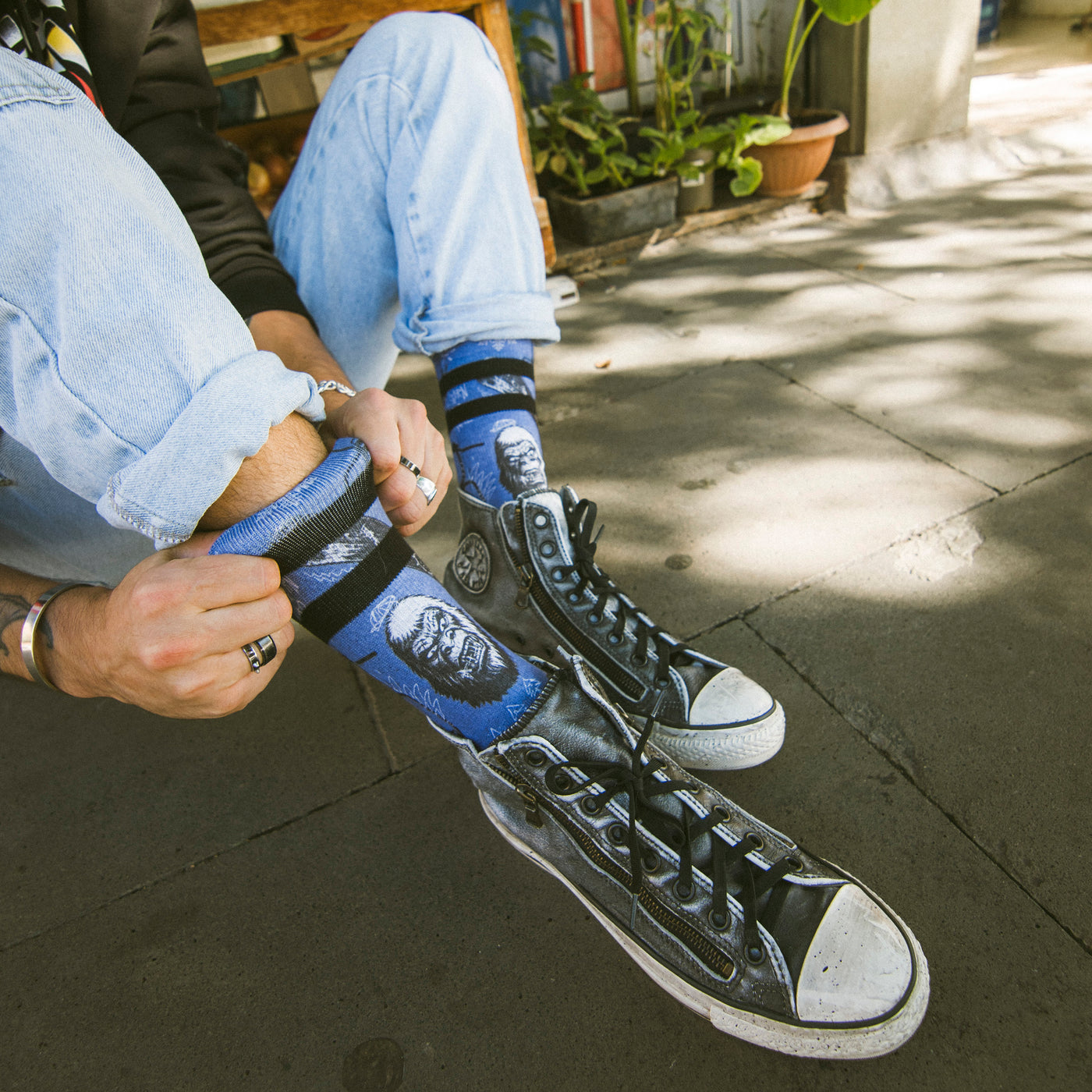 Man showing skater socks with cool yeti and winter sports design american socks