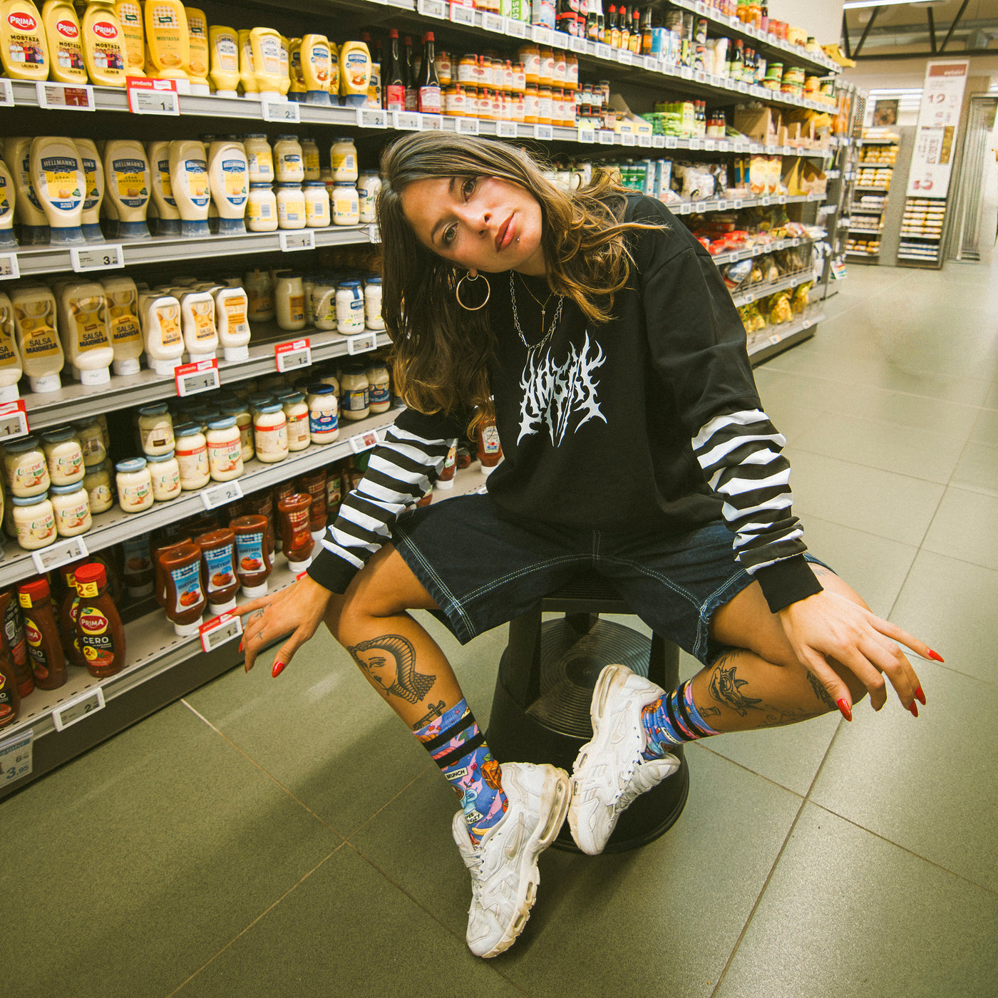 Woman in a supermarket wearing cool alternative punk clothing american socks